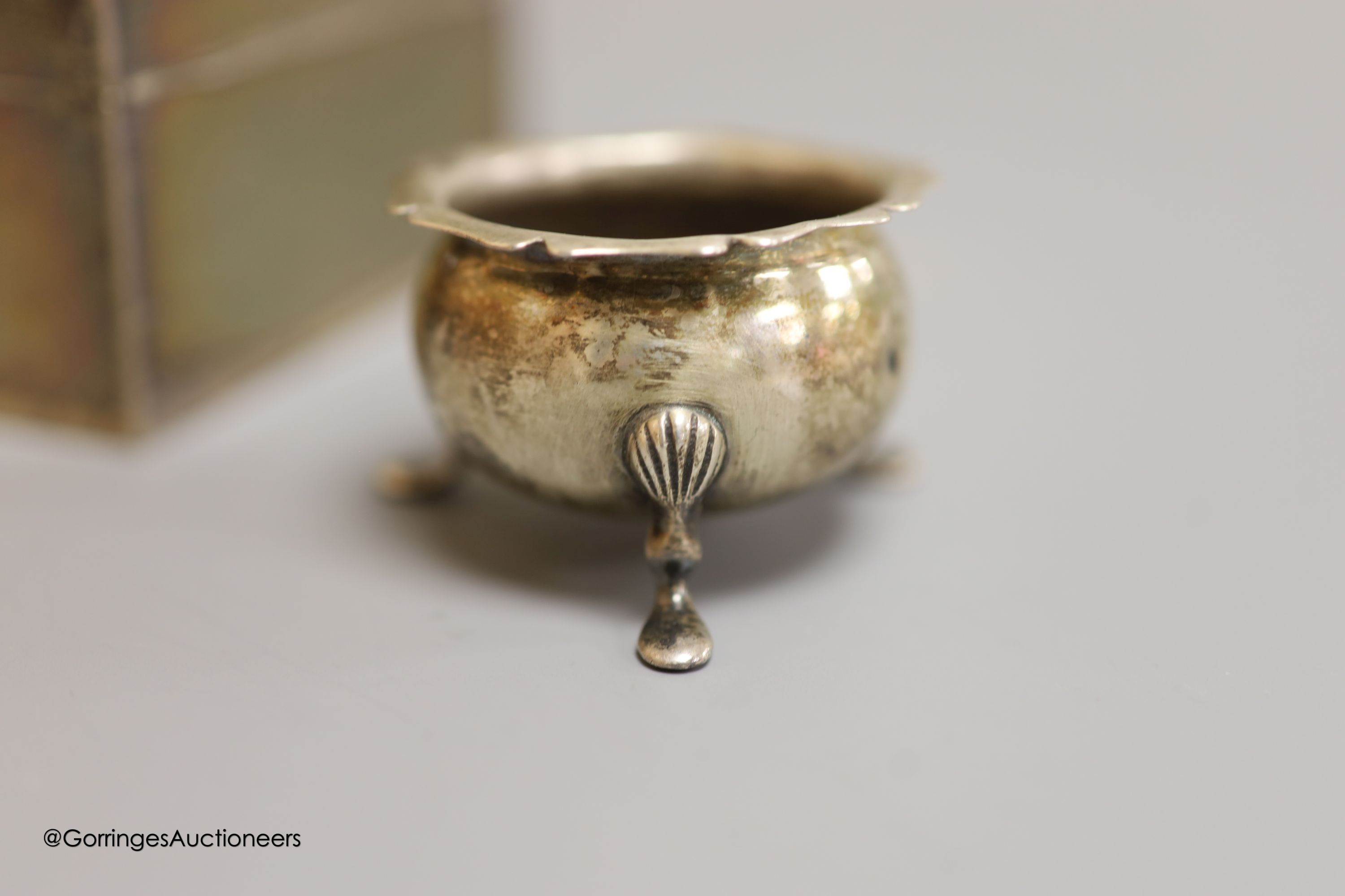 A George V silver rectangular cigarette box, Birmingham, 1926,16.5cm, a silver christening mug and a silver salt.